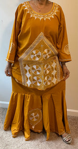 African Skirt Set made in Ghana has embroidery on the top and bottom.